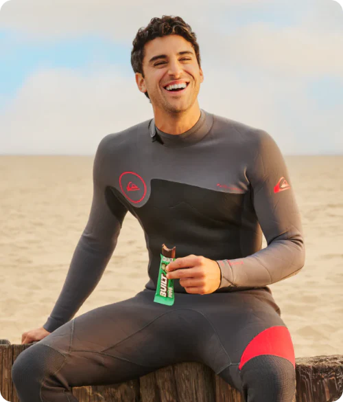 Surfer eating a BUILT Puff
